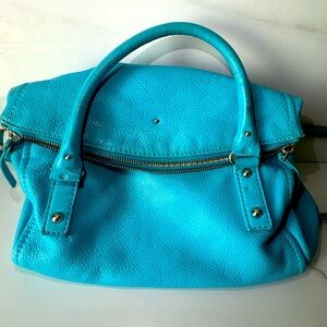 Pre loved Kate Spade convertible crossbody with visible signs of wear and fade